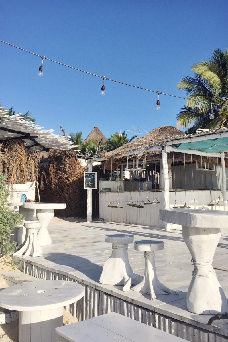 tulum beach bar with swings